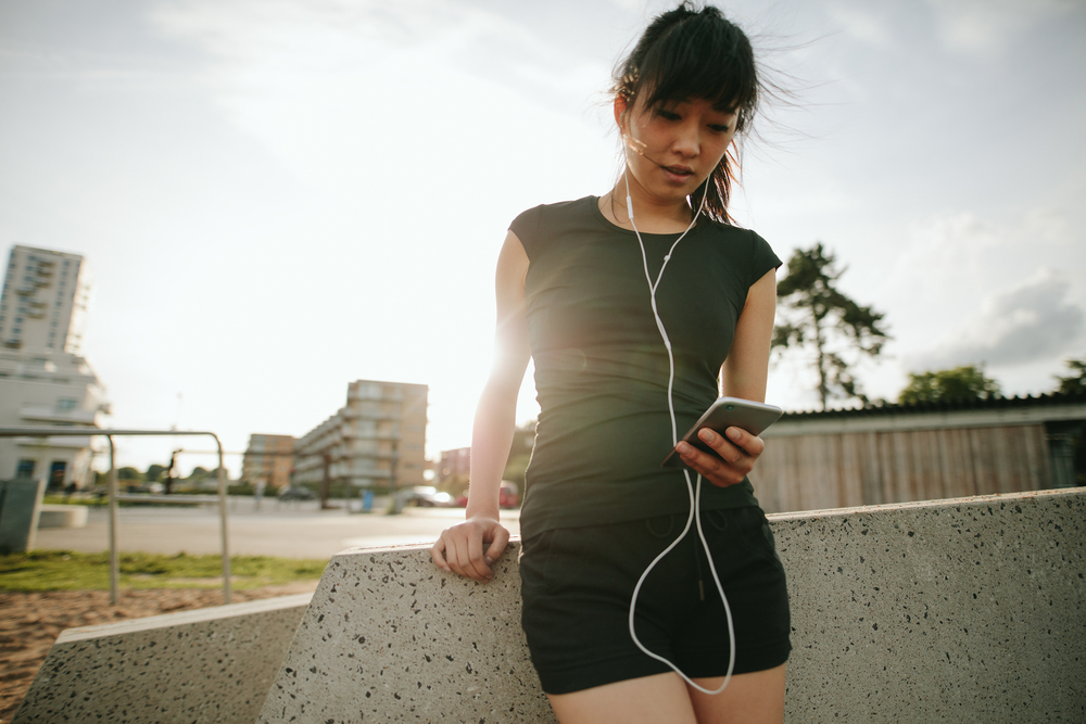 woman exercising with phone