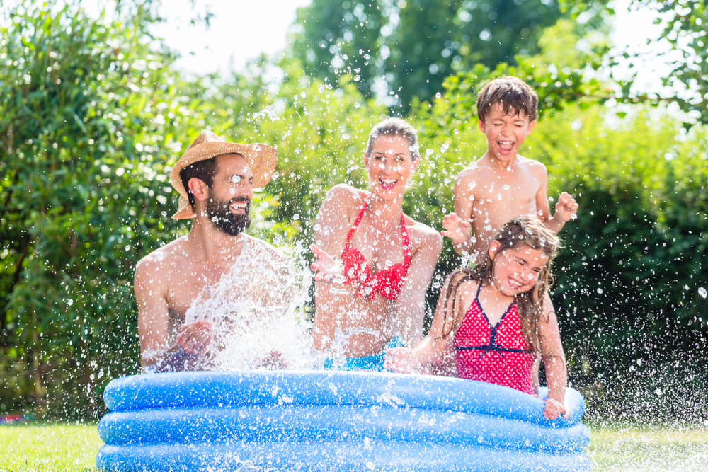 Family playing in an inflatable pool