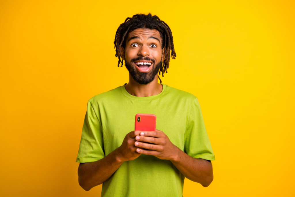 happy man holding his phone